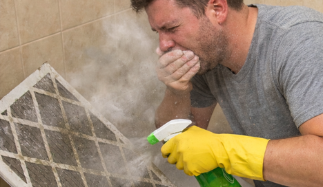 homeowner performing DIY Air Filter