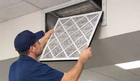 technician performing professional Air Filter Replacement 
