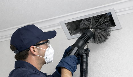 technician performing professional air vent clean