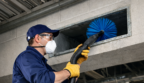 technician performing professional furnace maintenance