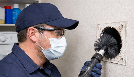technician performing professional Dryer Vent Cleaning
