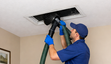 technician performing professional furnace maintenance
